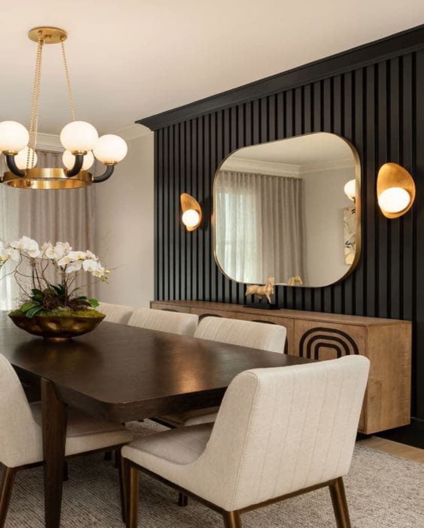 Black WPC wall panel backdrop in elegant dining room with gold decor and chandelier