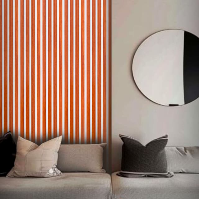 Vertical wood-textured WPC panels behind modern sofa